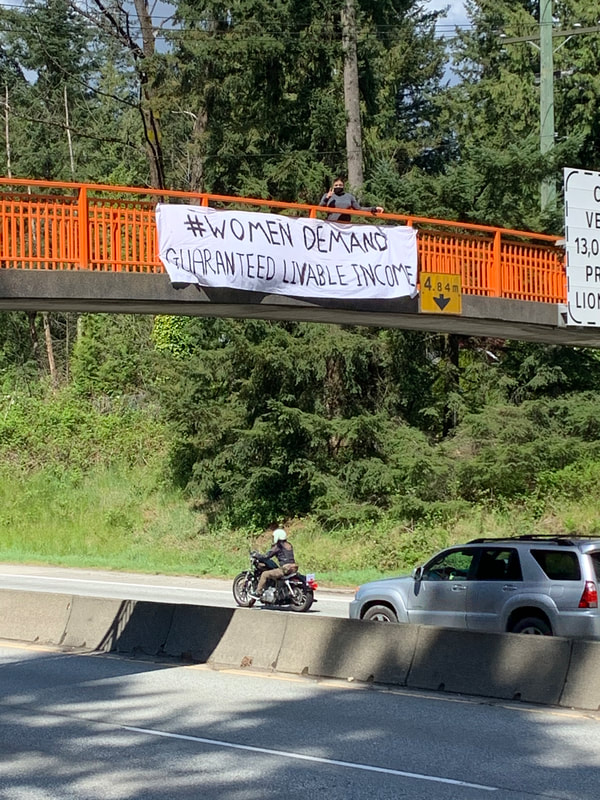 #womendemand Guaranteed Livable Income. Banner North Vancouver