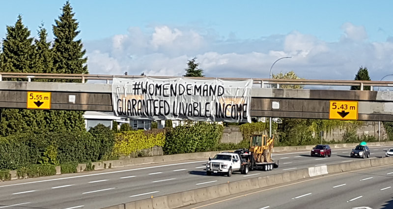 #womendemand Guaranteed Livable Income. Banner Cassiar Vancouver
